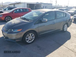 2010 Honda Insight EX with VIN JHMZE2H73AS039935, listed as a Copart auction lot 46192575 with 127,329 mi miles and Salvage Title. Bid and sale history available at DreamBid. Image 1.