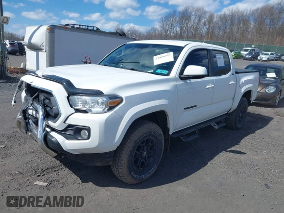 2020 Toyota Tacoma SR5 with VIN 3TMCZ5AN5LM339977, listed as a IAAI auction lot 41886937 with 94,986 mi miles and . Bid and sale history available at DreamBid. Image 2.