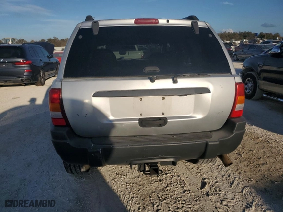 2004 Jeep Grand Cherokee Laredo with VIN 1J4GX48N74C406647, listed as a Copart auction lot 77631654 with 174,824 mi miles and Salvage Title. Bid and sale history available at carsss.com. Image 6.