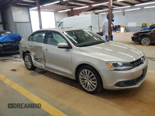 2014 Volkswagen Jetta TDI w/Premium with VIN 3VWLL7AJ9EM261908, listed as a Copart auction lot 60703205 with 128,892 mi miles and Salvage title. Bid and sale history available at DreamBid. Image 4.