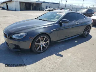 2015 BMW M6 z VIN WBSLX9C58FD160609, wystawiony jako Copart lot #56992535 z przebiegiem 52 324 mil mil oraz Tytuł czysty. Historia ofert i sprzedaży dostępna na DreamBid. Obrazek 1.