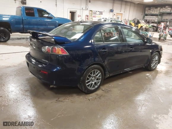 2013 Mitsubishi Lancer SE with VIN JA32V2FW9DU005616, listed as a IAAI auction lot 41247087 with 129,055 mi miles. Bid and sale history available at carsss.com. Image 4.