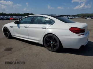 2015 BMW M6 z VIN WBS6C9C5XFD467711, wystawiony jako Copart lot #66574644 z przebiegiem 101 001 mil mil oraz Szkody całkowita. Historia ofert i sprzedaży dostępna na DreamBid. Obrazek 2.