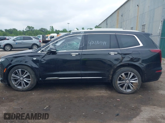 2020 Cadillac XT6 FWD Premium Luxury z VIN 1GYKPCRS6LZ148058, wystawiony jako IAAI lot #42416949 z przebiegiem 79 318 mil mil oraz . Historia ofert i sprzedaży dostępna na DreamBid. Obrazek 14.