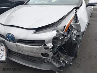 2022 Toyota Prius L Eco with VIN JTDKAMFU0N3181467, listed as a IAAI auction lot 41802679 with 121,749 mi miles. Bid and sale history available at carsss.com. Image 6.