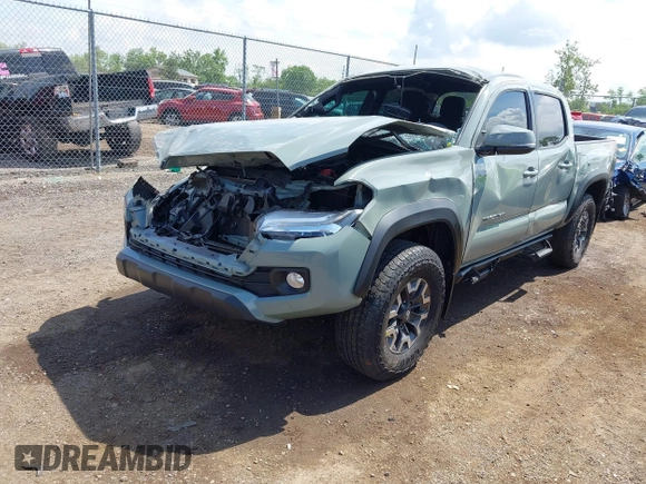 2023 Toyota Tacoma SR with VIN 3TMCZ5AN1PM581266, listed as a IAAI auction lot 42371395 with 32,582 mi miles and . Bid and sale history available at DreamBid. Image 2.