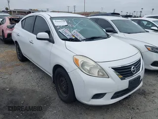 2014 Nissan Versa SV with VIN 3N1CN7AP0EL869083, listed as a IAAI auction lot 42044279 with 143,568 mi miles. Bid and sale history available at carsss.com. Image 1.