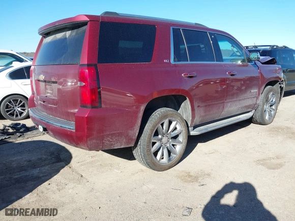 2016 Chevrolet Tahoe LTZ with VIN 1GNSKCKC9GR205745, listed as a IAAI auction lot 41710241 with 94,931 mi miles. Bid and sale history available at carsss.com. Image 4.