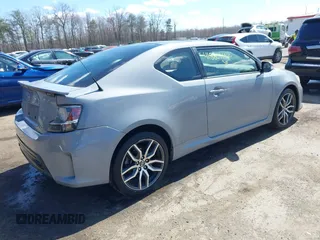 2014 Scion tC with VIN JTKJF5C70E3083839, listed as a IAAI auction lot 41886711 with 118,029 mi miles. Bid and sale history available at carsss.com. Image 4.