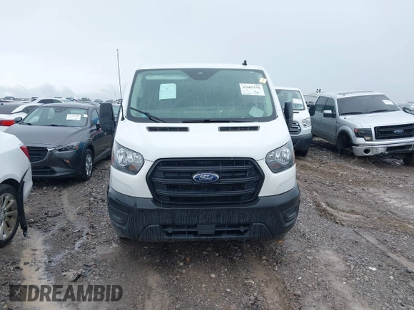 2020 Ford Transit Cargo with VIN 1FTBR1Y88LKB48985, listed as a IAAI auction lot 42009136 with 127,124 mi miles and . Bid and sale history available at DreamBid. Image 13.