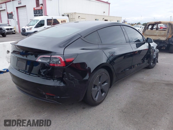 2022 Tesla Model 3 with VIN 5YJ3E1EA7NF314744, listed as a IAAI auction lot 42057596 with 30,936 mi miles and . Bid and sale history available at DreamBid. Image 4.