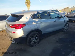 2019 BMW X2 sDrive28i with VIN WBXYJ3C54KEP77217, listed as a IAAI auction lot 41079851 with 100,149 mi miles. Bid and sale history available at carsss.com. Image 4.