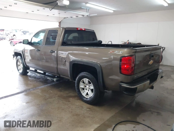 2014 Chevrolet Silverado 1500 LT with VIN 1GCVKREC5EZ147506, listed as a IAAI auction lot 41736960 with 112,399 mi miles and . Bid and sale history available at DreamBid. Image 3.