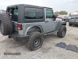 2014 Jeep Wrangler Sport with VIN 1C4AJWAG0EL265409, listed as a IAAI auction lot 41726935 with 78,547 mi miles and . Bid and sale history available at DreamBid. Image 4.