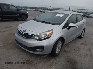 2013 Kia Rio SX with VIN KNADN4A3XD6168179, listed as a IAAI auction lot 41909704 with 79,653 mi miles. Bid and sale history available at carsss.com. Image 2.