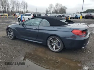 2013 BMW M6 z VIN WBSLZ9C55DDZ77804, wystawiony jako Copart lot #54121185 z przebiegiem 66 286 mil mil oraz Czysty tytuł • Clean title. Historia ofert i sprzedaży dostępna na DreamBid. Obrazek 2.