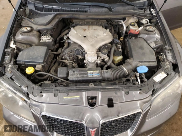 2009 Pontiac G8 z VIN 6G2ER57739L205634, wystawiony jako Copart lot #58935145 z przebiegiem 181 490 mil mil oraz Czysty tytuł • Clean title. Historia ofert i sprzedaży dostępna na DreamBid. Obrazek 11.
