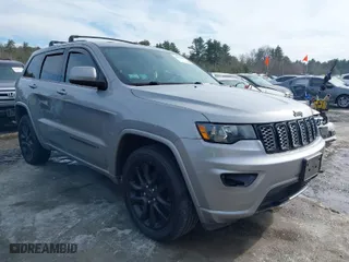 2018 Jeep Grand Cherokee Laredo E with VIN 1C4RJFAG1JC487082, listed as a IAAI auction lot 41663081 with 136,853 mi miles. Bid and sale history available at carsss.com. Image 1.