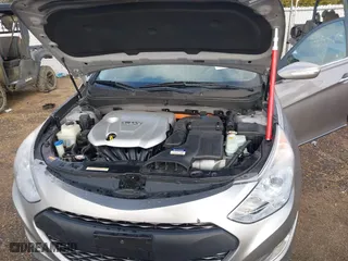 2013 Hyundai Sonata Hybrid with VIN KMHEC4A41DA092477, listed as a IAAI auction lot 41453656 with 124,804 mi miles. Bid and sale history available at carsss.com. Image 10.