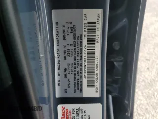 2021 Mazda 3 Premium Plus with VIN JM1BPBNYXM1403126, listed as a Copart auction lot 59971535 with 56,952 mi miles and Salvage title. Bid and sale history available at DreamBid. Image 12.