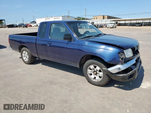 1999 Nissan Frontier XE with VIN 1N6DD26S9XC307893, listed as a Copart auction lot 66045605 with 239,269 mi miles and Salvage title. Bid and sale history available at DreamBid. Image 4.