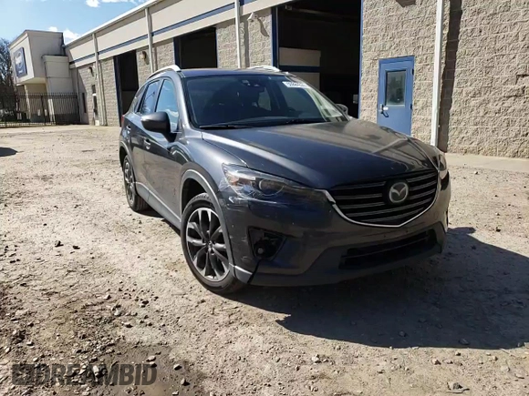 2016 Mazda CX-5 Grand Touring with VIN JM3KE4DY8G0616421, listed as a Copart auction lot 50884525 with 182,048 mi miles and Salvage Title. Bid and sale history available at DreamBid. Image 12.