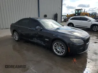 2011 BMW 7 Series 740i with VIN WBAKA4C52BC612977, listed as a Copart auction lot 52582575 with 157,813 mi miles and Salvage Title. Bid and sale history available at carsss.com. Image 4.