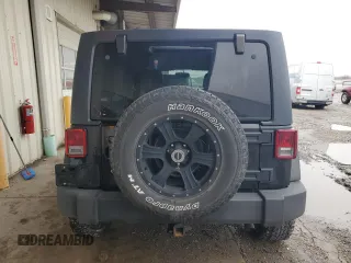 2014 Jeep Wrangler Unlimited Sport with VIN 1C4BJWDG2EL319714, listed as a Copart auction lot 47924575 with 129,294 mi miles and Salvage Title. Bid and sale history available at DreamBid. Image 6.