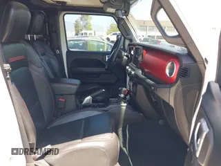 2018 Jeep Wrangler Unlimited Rubicon with VIN 1C4HJXFN8JW215023, listed as a IAAI auction lot 42227099 with 62,195 mi miles and . Bid and sale history available at DreamBid. Image 5.