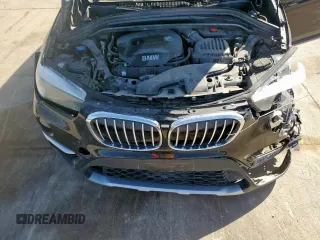 2018 BMW X1 sDrive28i with VIN WBXHU7C31J5H39068, listed as a Copart auction lot 49018985 with 100,611 mi miles and Salvage Title. Bid and sale history available at carsss.com. Image 14.