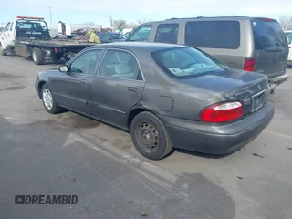 2001 Mazda 626 LX with VIN 1YVGF22C815218444, listed as a IAAI auction lot 41940404 with 143,080 mi miles. Bid and sale history available at carsss.com. Image 3.