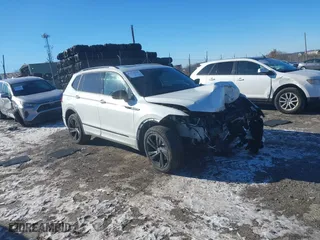 2023 Volkswagen Tiguan SE R-Line Black with VIN 3VVCB7AX8PM141998, listed as a IAAI auction lot 41278010 with 230,000 mi miles. Bid and sale history available at carsss.com. Image 1.