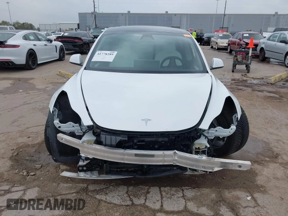 2021 Tesla Model 3 Long Range with VIN 5YJ3E1EB3MF059713, listed as a IAAI auction lot 41778289 with 52,211 mi miles. Bid and sale history available at carsss.com. Image 13.