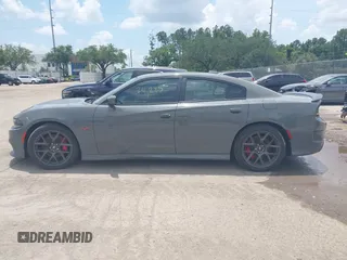 2019 Dodge Charger Scat Pack with VIN 2C3CDXGJ2KH633854, listed as a IAAI auction lot 42212517 with 74,285 mi miles and . Bid and sale history available at DreamBid. Image 14.