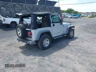 2004 Jeep Wrangler Sport with VIN 1J4FA49S04P781581, listed as a IAAI auction lot 42078693 with 111,123 mi miles and . Bid and sale history available at DreamBid. Image 4.