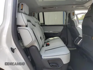 2025 Rivian R1S Adventure z VIN 7PDSGBBA5SN067374, wystawiony jako Copart lot #55279895 z przebiegiem 1 120 mil mil oraz Szkoda całkowita • Salvage title. Historia ofert i sprzedaży dostępna na DreamBid. Obrazek 11.