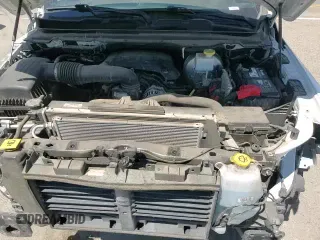 2020 Ram 1500 Big Horn z VIN 1C6RREBT9LN121612, wystawiony jako Copart lot #68733355 z przebiegiem 79 061 mil mil oraz Szkoda całkowita • Salvage title. Historia ofert i sprzedaży dostępna na DreamBid. Obrazek 14.