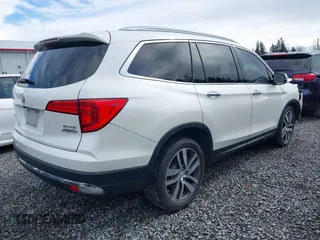 2016 Honda Pilot Elite with VIN 5FNYF6H05GB062868, listed as a IAAI auction lot 41804794 with 1 mi miles. Bid and sale history available at carsss.com. Image 4.