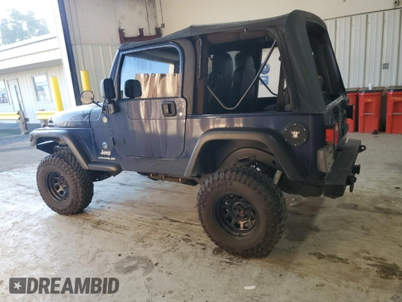 2006 Jeep Wrangler SE with VIN 1J4FA29126P705827, listed as a Copart auction lot 82226674 with 165,632 mi miles and Salvage Title. Bid and sale history available at carsss.com. Image 2.