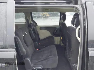 2015 Dodge Grand Caravan SXT with VIN 2C4RDGCG8FR556861, listed as a IAAI auction lot 42224948 with 110,797 mi miles and . Bid and sale history available at DreamBid. Image 8.
