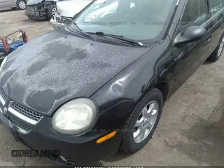 2003 Dodge Neon SXT with VIN 1B3ES56C63D251649, listed as a IAAI auction lot 27562059 with 222,302 mi miles. Bid and sale history available at carsss.com. Image 6.