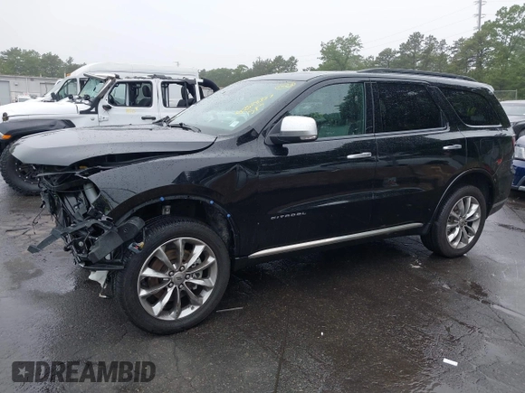 2023 Dodge Durango Citadel with VIN 1C4RDJEG1PC582304, listed as a IAAI auction lot 42528327 with 9,896 mi miles and . Bid and sale history available at DreamBid. Image 2.