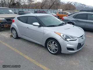 2013 Hyundai Veloster w/Black Int with VIN KMHTC6AD6DU115494, listed as a IAAI auction lot 41821856 with 121,115 mi miles. Bid and sale history available at carsss.com. Image 1.