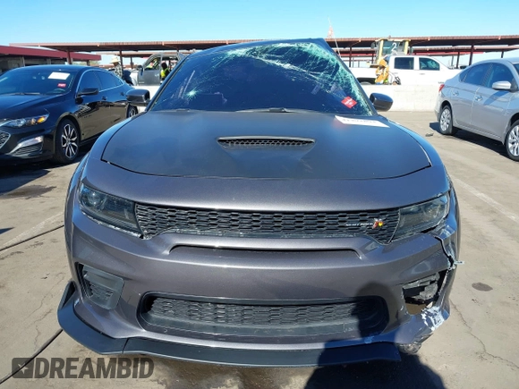 2022 Dodge Charger Scat Pack Widebody with VIN 2C3CDXGJ1NH204130, listed as a IAAI auction lot 41392893 with 9,515 mi miles and . Bid and sale history available at DreamBid. Image 12.