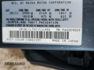 2012 Mazda 3 i Touring with VIN JM1BL1L7XC1534992, listed as a Copart auction lot 63142035 with 122,952 mi miles and Salvage title. Bid and sale history available at DreamBid. Image 12.