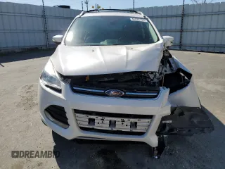 2016 Ford Escape Titanium with VIN 1FMCU0J99GUB83458, listed as a Copart auction lot 48828195 with 74,250 mi miles and Salvage Title. Bid and sale history available at carsss.com. Image 5.