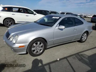 2000 Mercedes-Benz CLK 320/430 with VIN WDBLJ65G8YF122308, listed as a Copart auction lot 77449314 with 105,121 mi miles and Salvage Title. Bid and sale history available at DreamBid. Image 1.