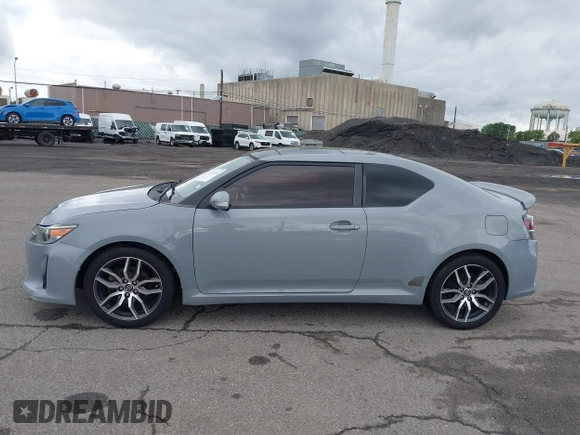 2014 Scion tC z VIN JTKJF5C71E3081033, wystawiony jako IAAI lot #42333111 z przebiegiem 144 124 mil mil oraz . Historia ofert i sprzedaży dostępna na DreamBid. Obrazek 14.