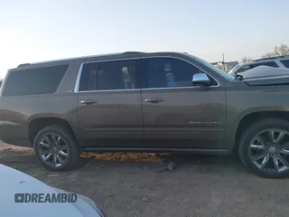 2015 Chevrolet Suburban LTZ with VIN 1GNSKKKC1FR628182, listed as a IAAI auction lot 41801391 with Not Provided miles and . Bid and sale history available at DreamBid. Image 13.
