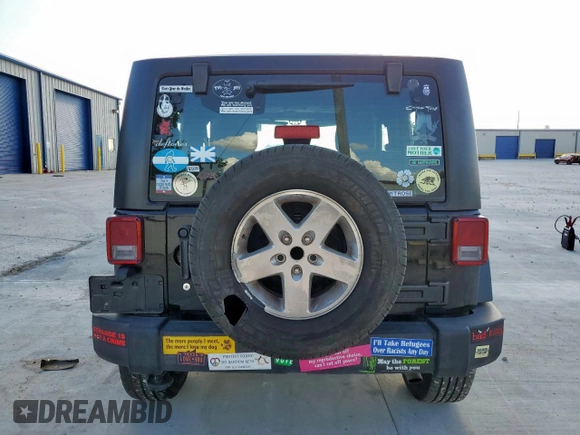 2015 Jeep Wrangler Freedom Edition with VIN 1C4AJWAG8FL541675, listed as a Copart auction lot 62647855 with 53,915 mi miles and Salvage title. Bid and sale history available at DreamBid. Image 6.